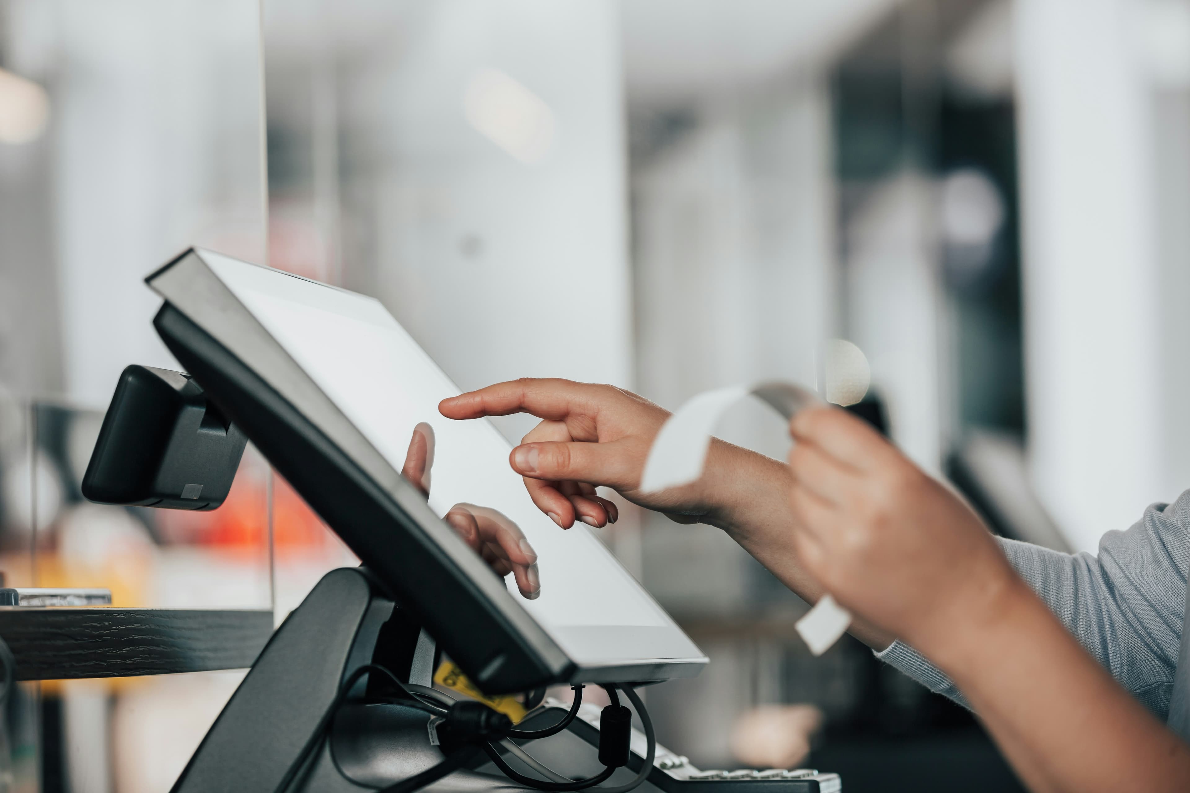 Cashier using DigiNizam POS
